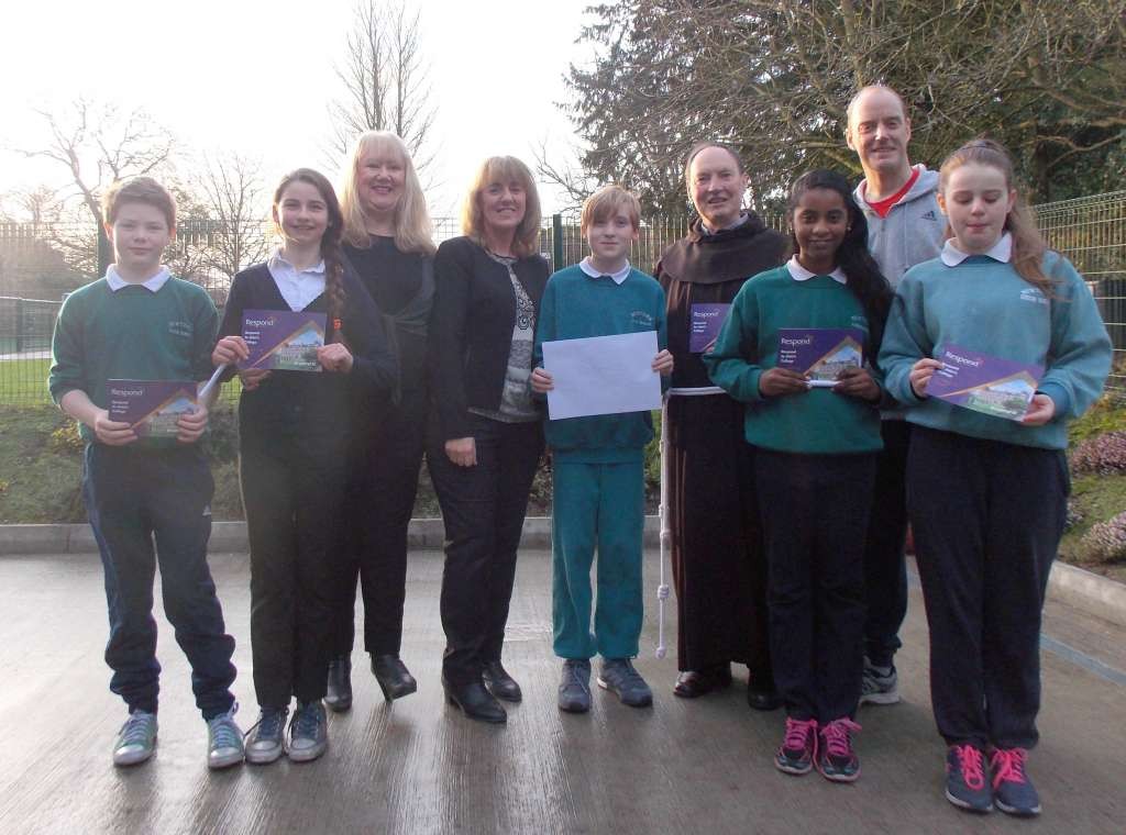 Pictured from L-R Milo Curran, Isobel Killian, Patricia Garry Dep. Principal Newtown Junior School, Deirdre McCarthy Respond, Reuben O’Callaghan, Fr. Pat Cogan Respond, Dania Eltayeb, Colin Busher Newtown Junior School, Sorcha Nutty.